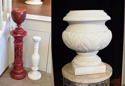 Lot 184 - A White Marble Urn, 19th century, of baluster form carved with stylised leaves on a square...