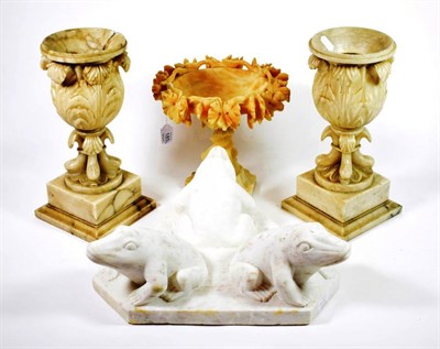 Lot 185 - A Pair of Carved Marble Urns, late 19th/early 20th century, of baluster form decorated with...