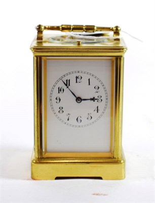 Lot 218 - {} A Brass Striking and Repeating Carriage Clock, circa 1900, carrying handle and repeat...