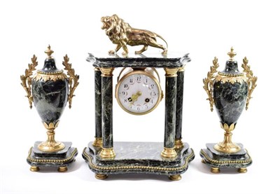 Lot 220 - {} A Green Marble Striking Portico Mantel Clock with Garniture, early 20th century, case surmounted