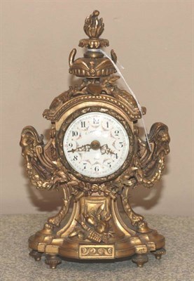 Lot 241 - An Ormolu Mantel Timepiece, circa 1900, urn shaped finial, side rams head masks and swag...