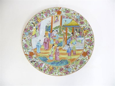 Lot 266 - A Cantonese Porcelain Charger, 19th century, typically painted in famille rose enamels with figures