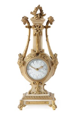 Lot 252 - A Marble and Gilt Metal Mounted Lyre Shaped Mantel Timepiece, circa 1900, lyre case with mask...