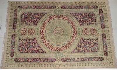 Lot 257 - Indian Carpet, modern The compartmentalised field centred by a roundel medallion framed by...