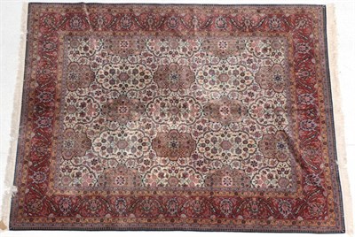 Lot 259 - Kashan Design Carpet Probably India, circa 1970 The ivory lattice field of plants and flowers,...