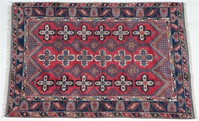 Lot 273 - ~ Dosemalti Carpet West Turkey, modern The crimson field with hooked medallions and cruciform...