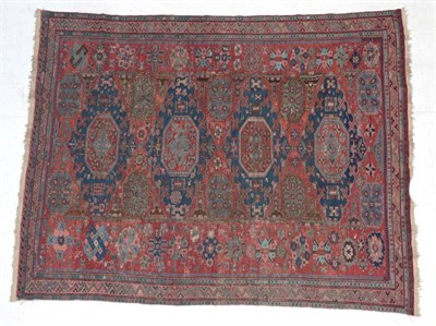 Lot 282 - East Caucasian Soumakh, circa 1875 The flat woven brick red field with four indigo medallions...