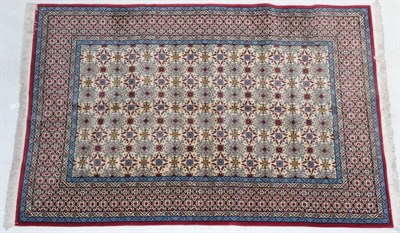 Lot 285 - Indian Carpet, modern The cream ground of 'boteh' enclosed by lattice borders, 300cm by 205cm