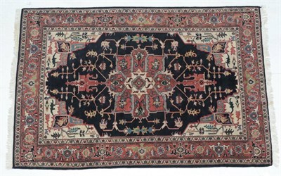 Lot 286 - Heriz Design Carpet, India The indigo field of angular vines around a typical medallion framed...