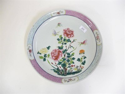 Lot 271 - A Chinese Porcelain Saucer Dish, 19th century, painted in famille rose enamels with butterflies...