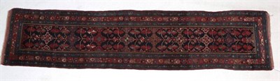 Lot 301 - Good North West Persian Runner, circa 1900 The deep indigo field with a row of hooked guls and...