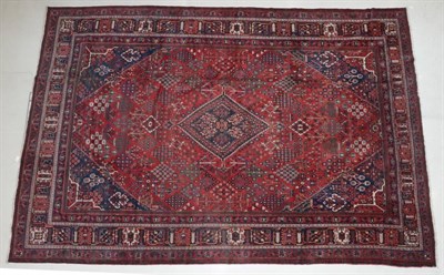 Lot 302 - Joshagan Carpet Central Iran, circa 1920 The madder field of geometric plants around a stepped...