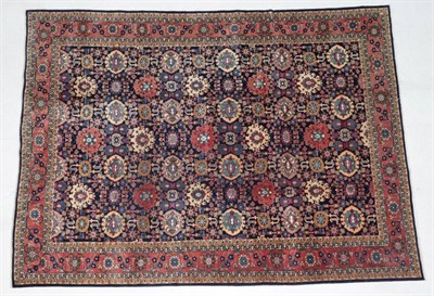 Lot 304 - Tabriz Carpet Iranian Azerbaijan, circa 1970 The indigo field with an allover design of...