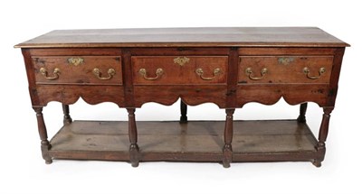 Lot 309 - A Joined Oak Low Dresser, basically mid 18th century, the moulded top above three deep frieze...