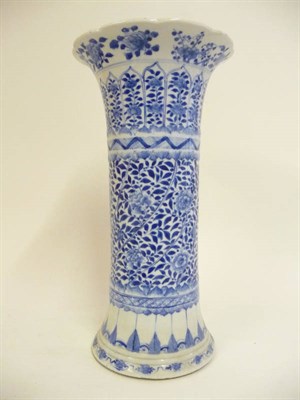 Lot 272 - A Chinese Porcelain Beaker Vase, 19th century, with wrythen fluted central panel painted in...