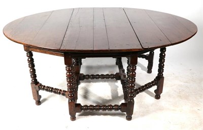 Lot 311 - A Late 17th Century Oak Six-to-Eight Seater Dropleaf Dining Table, with two rounded leaves...