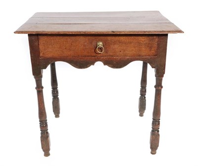 Lot 313 - ^ An Early 18th Century Oak Side Table, the top of plank construction above a single frieze...