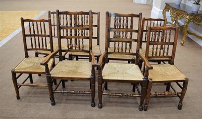 Lot 319 - A Harlequin Set of Eight 19th Century North West Region Spindle Back and Rush Seated Dining Chairs