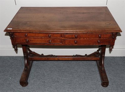 Lot 320 - A Victorian Oak Side Table, late 19th century, the moulded top above four small frieze drawers,...