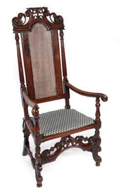 Lot 325 - ^ A Charles II Walnut High-Back Armchair, late 17th century, with caned back support and seat,...