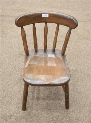 Lot 332 - A 19th Century Child's Beech Dining Chair, with curved top rail above spindle supports, the moulded