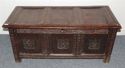 Lot 341 - A 17th Century Joined Oak Chest, the hinged lid with three panels above a carved frieze and...