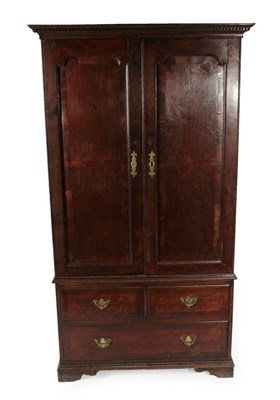 Lot 345 - An Oak Wardrobe, of attractive proportions, the dentil cornice above crossbanded and moulded...