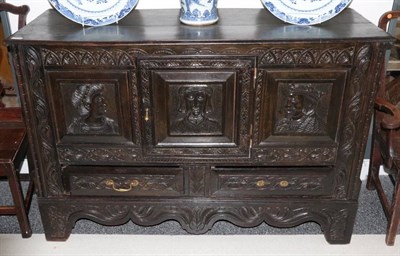 Lot 354 - A 17th Century Joined Oak Cupboard, later carved with three panels depicting Henry VIII and Anne of