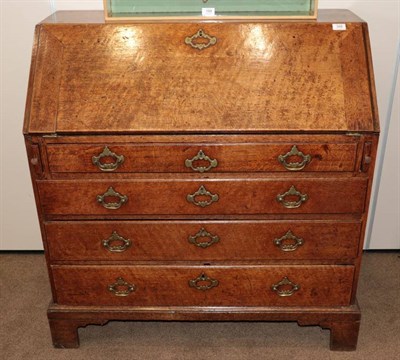 Lot 356 - ^ A George II Oak Bureau, mid 18th century, the fall enclosing a fitted interior of pigeon...