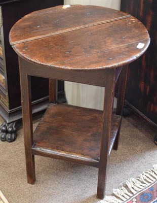 Lot 366 - A Late George III Oak Cricket Table, early 19th century, the circular top above a plain frieze...