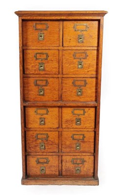 Lot 368 - ~ An Early 20th Century Oak Filing Cabinet, the twelve small drawers with recessed brass...