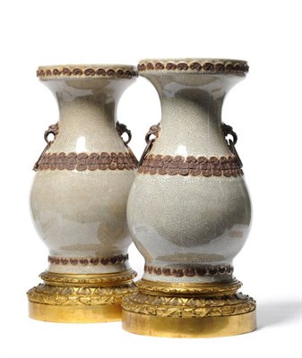 Lot 278 - A Pair of Chinese Gilt Metal Mounted Porcelain Baluster Vases, 19th century, of archaic form...