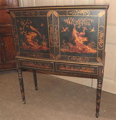 Lot 396 - A Regency Ebonised and Painted Two Door Cabinet on Stand, possibly Dutch, early 19th century,...