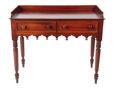 Lot 408 - {} A Victorian Mahogany Washstand or Writing Table, mid 19th century, the three-quarter gallery...