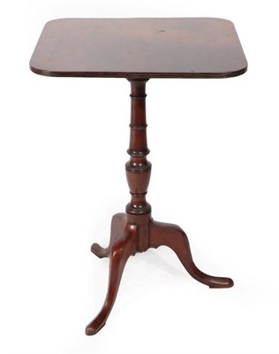 Lot 414 - ~ A Late George III Mahogany Fliptop Tripod Table, early 19th century, the reeded edge above a...