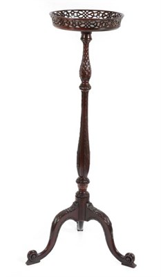 Lot 416 - ~ A Victorian Carved Mahogany Plant Stand, late 19th century, in George II style, the circular fret