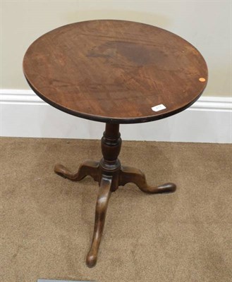 Lot 417 - ~ A George III Mahogany Fliptop Tripod Table, late 18th century, the circular top on a turned...