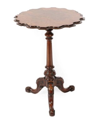 Lot 420 - ~ A Victorian Burr Walnut Tripod Table, 3rd quarter 19th century, the moulded top on a baluster...