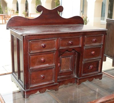 Lot 426 - A Victorian Mahogany Miniature Sideboard, mid 19th century, the shaped back above an arrangement of