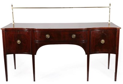 Lot 434 - A George III Mahogany and Boxwood Strung Serpentine Shape Sideboard, circa 1800, with a brass...