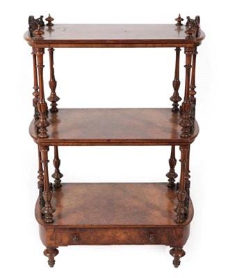 Lot 435 - A Victorian Figured Walnut Three-Tier Whatnot, circa 1870, with fluted spindle supports and pierced