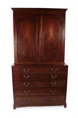 Lot 436 - A George III Mahogany Secretaire Bookcase, circa 1800, the bold pediment above moulded cupboard...