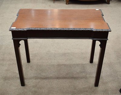 Lot 438 - A Carved Mahogany Side or Silver Table, in George II style, the moulded top with a stiff leaf...