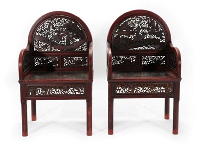 Lot 456 - A Pair of 20th Century Chinese Softwood Armchairs, the back supports foliate carved with figures in