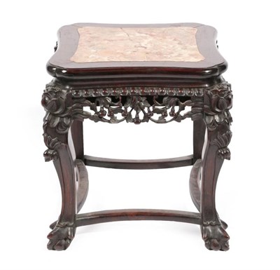 Lot 458 - A Chinese Carved Padouk Wood and Pink Marble Plant Stand, early 20th century, the moulded top above