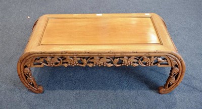 Lot 461 - A 20th Century Chinese Carved Hardwood Coffee Table, the moulded top above a foliate carved...