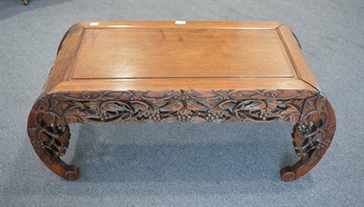 Lot 462 - A 20th Century Chinese Carved Hardwood Coffee Table, the moulded top above a foliate carved...