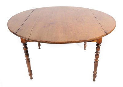 Lot 466 - ^ An Early 19th Century Fruitwood Four-to-Six Seater Dining Table, with two rounded drop leaves...