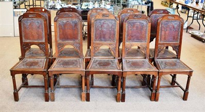 Lot 480 - A Set of Ten Oak and Leather Dining Chairs, circa 1900, covered in close-nailed brown leather...