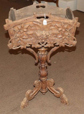 Lot 481 - A Continental Carved Oak Black Forest Style Planter Table, late 19th century, the top with two...